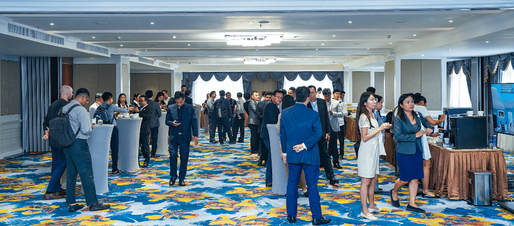 Cambodian entrepreneurs networking during a coffee break at the 3rd Young Entrepreneurs Gathering 2025, an event by YEAC and CCC on digital skills and AI.